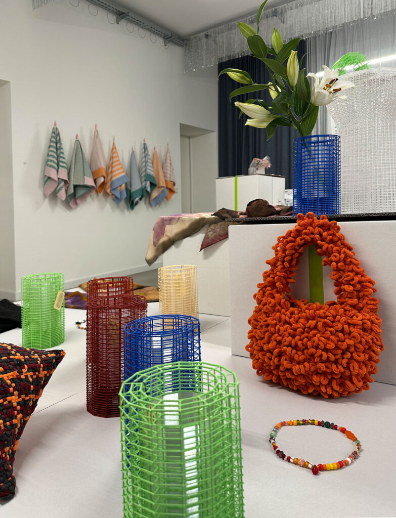 3d printed objects and handmade products on a table in a room where the christmas market took place